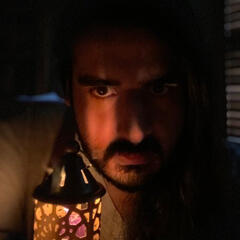 A bon fire at night, above it in a handwritten text are the words 'ritual six'